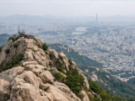Rocky summit view of Gwanaksan overlooking Seoul on a hazy day