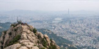Rocky summit view of Gwanaksan overlooking Seoul on a hazy day