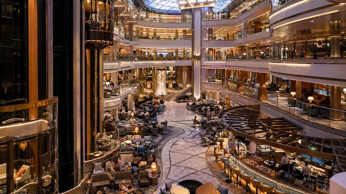 A grand interior atrium inside a modern cruise ship