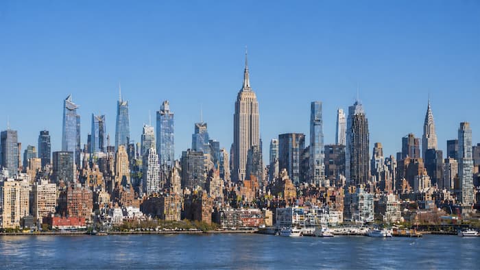 Panoramic view of the Manhattan skyline across the river on a clear day
