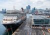 Why Busan, Incheon and Jeju Have Not Become True Cruise Hubs A large cruise ship docked at a modern Korean port terminal with a city skyline and harbor facilities in the background