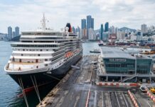 Why Busan, Incheon and Jeju Have Not Become True Cruise Hubs A large cruise ship docked at a modern Korean port terminal with a city skyline and harbor facilities in the background