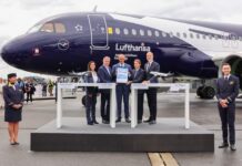 Lufthansa Group and Airbus executives celebrate 50 years of partnership in front of a Lufthansa Airbus A320neo at ILA Berlin Air Show