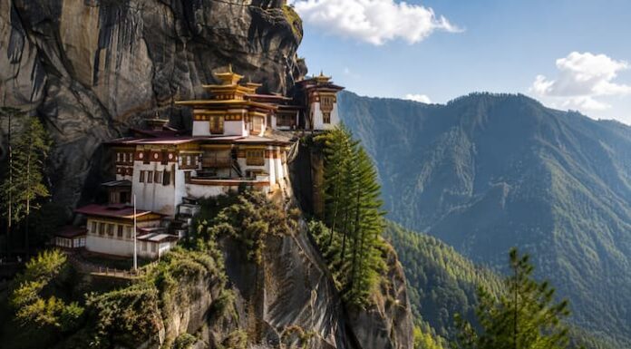 Bhutan Himalayan monastery and mountain landscape representing spiritual and wellness travel for Korean travelers