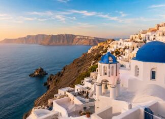 Santorini, the Island That Captured the World Through a Single Photograph Blue domes and whitewashed houses of Oia overlooking the Santorini caldera and the Aegean Sea