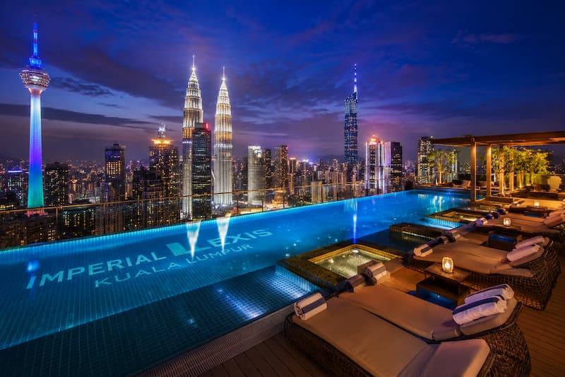 Rooftop infinity pool overlooking the Kuala Lumpur skyline at night
