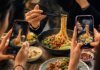 Social media creators filming food while a journalist records information at a tourism event