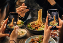 When the influencer becomes the attraction: What tourism marketing may be getting wrong Social media creators filming food while a journalist records information at a tourism event