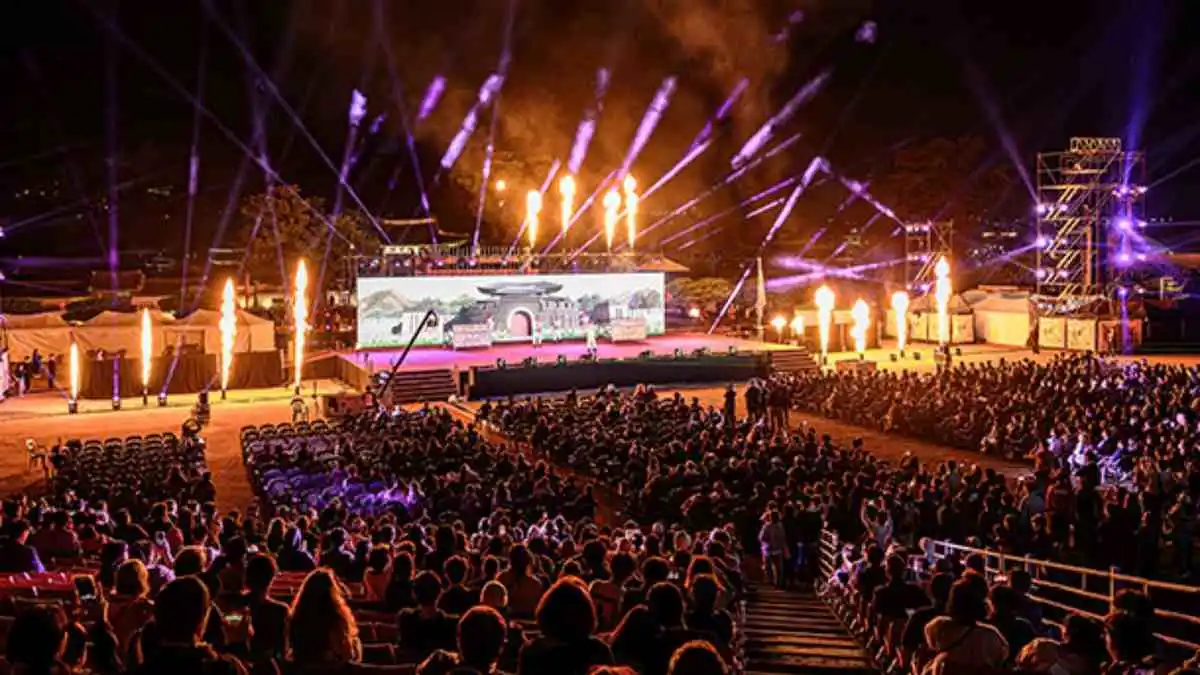 Crowds watching a spectacular nighttime performance at the Suwon Hwaseong Cultural Festival